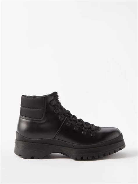 prada brixxen logo embossed leather boots